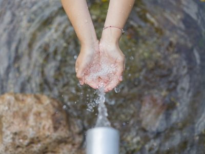 clear water coming out pipe into hands clear water coming out pipe into hands