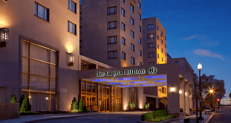 The Capital Hilton hotel in Washington DC at dusk.