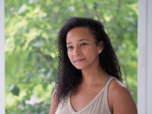 Headshot of Mariah Davis, with trees in the background