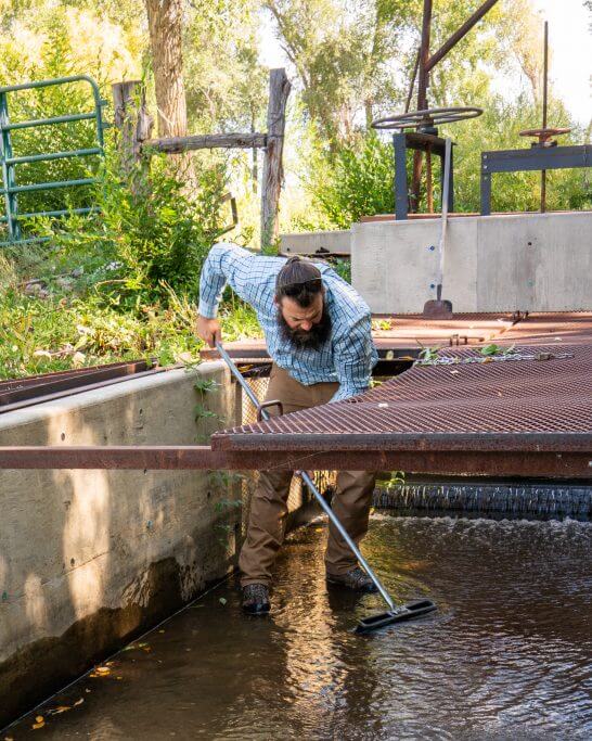 Ben Wolcott, a local rancher near Mancos, Colorado, cleaning a ditch. 