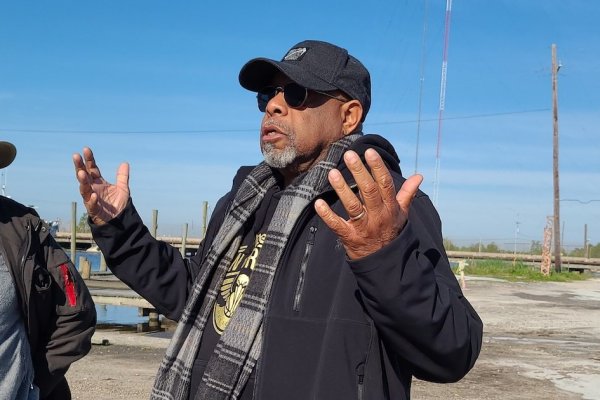 Arthur Johnson speaks at the water's edge in New Orleans.