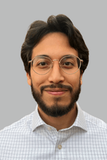 chrystopher-l.-garzon-rivera headshot of Chrys Garzon smiling and wearing glasses